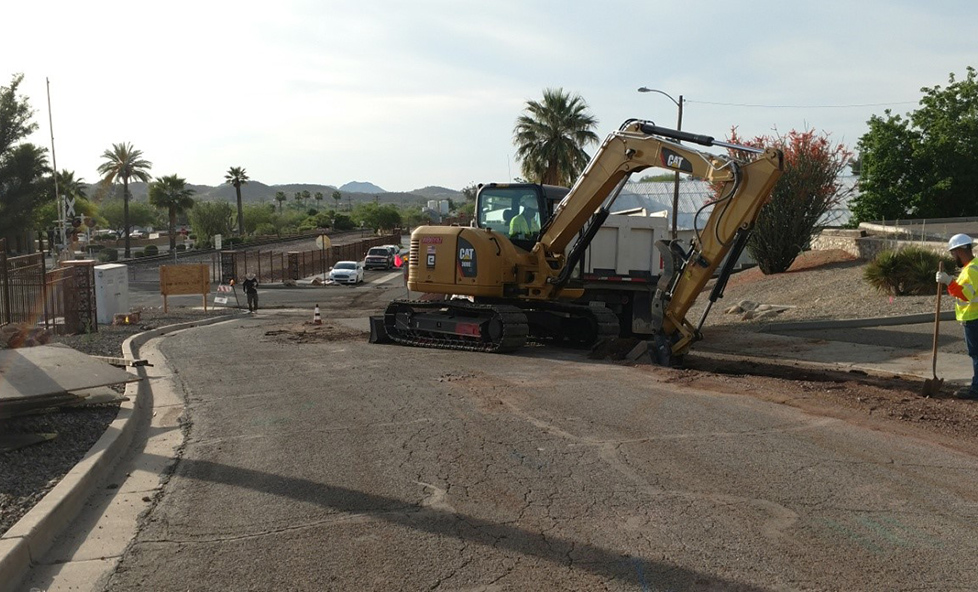 A Backhoe (aka digger) working on Washington Street.