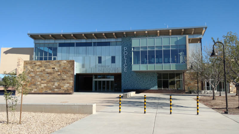 image of a modern building with glass features showing the police facility.