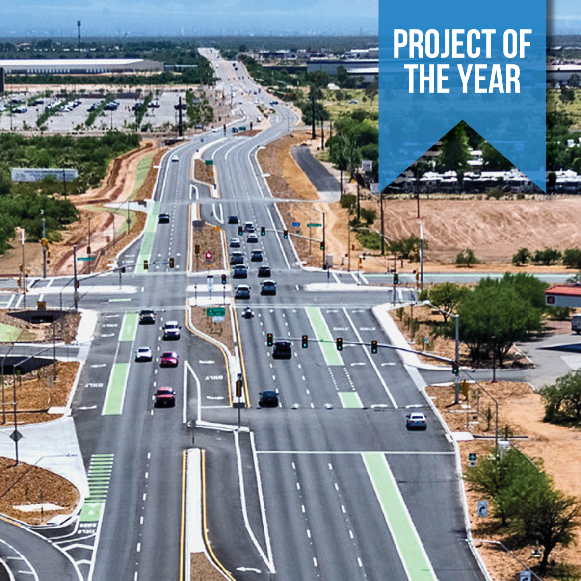 An aerial photo of a vehicle intersection with separated turn lanes and green bicycle lanes. The image has a ribbon on it that says "Project of the Year".